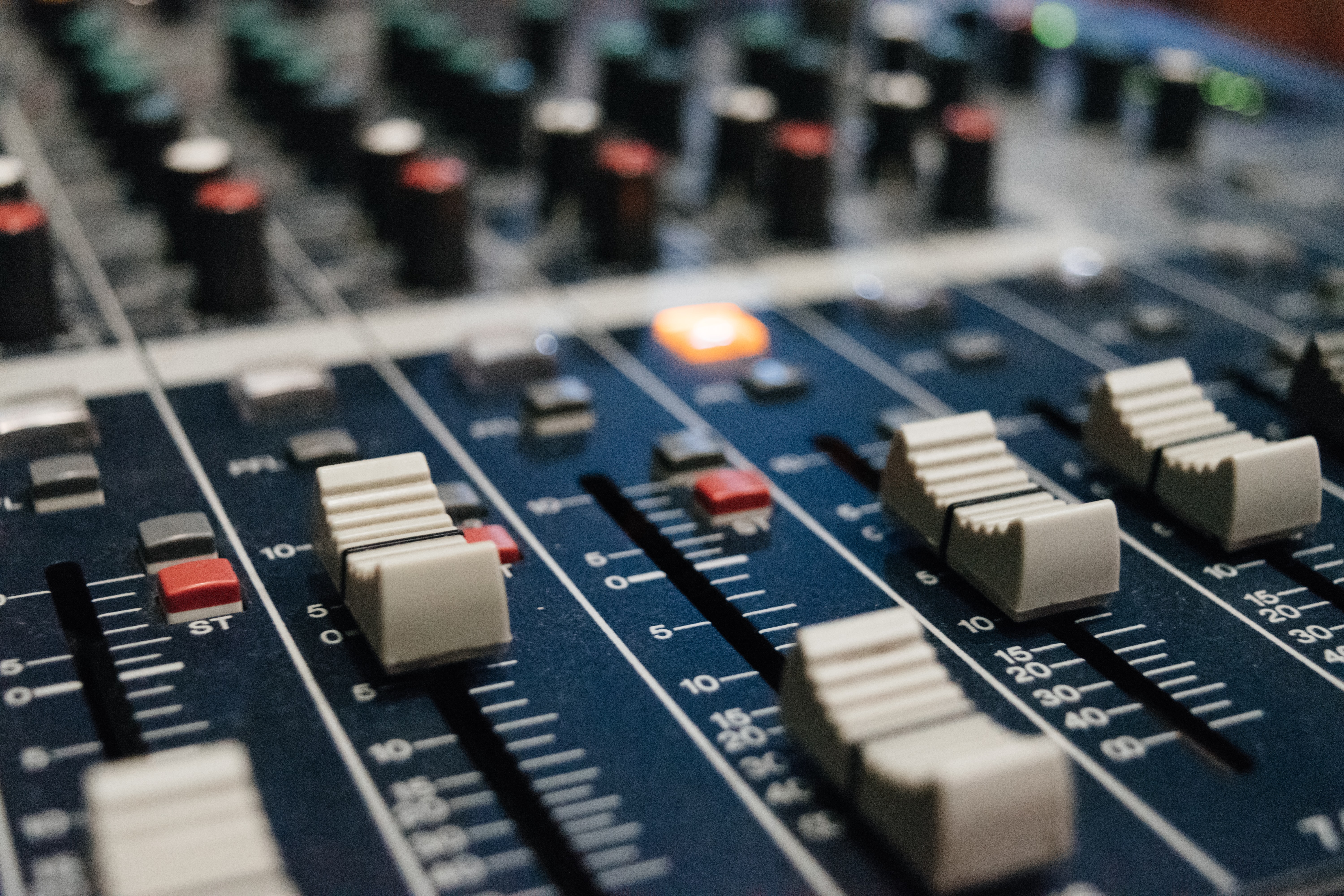 A close up of a mixing board